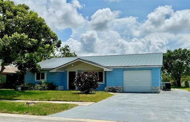 Extra wide 1 car garage with double parking pad