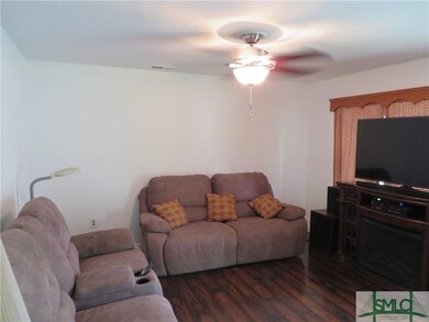 Living room shown with furnishings (TV blocking la