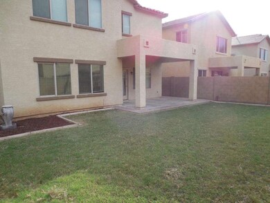 Covered Patio & Grass backyard
