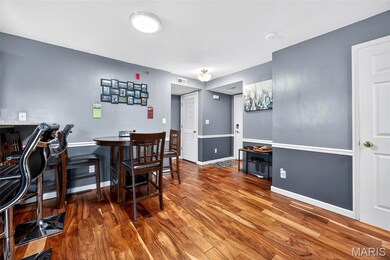 Dining area with wood finished floors and baseboards