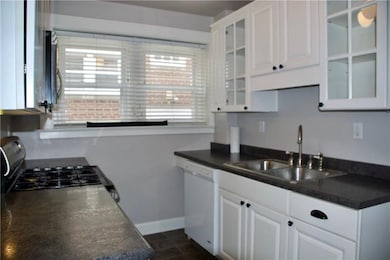 Wow describes this kitchen. Glass front cabinets, 