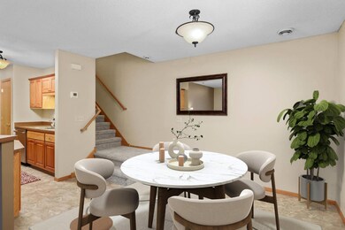 Spacious dining area connected to the kitchen and living room. The photo has been virtually staged.