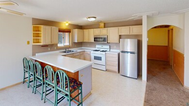 Kitchen with stainless steel appliances, sink, and