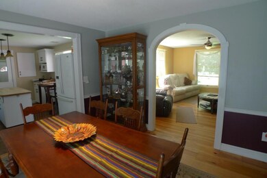 Dining room with arch into living...