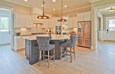 View of foyer and dining room from the Kitchen.Pic