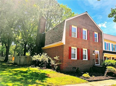 Large end unit townhome with a meandering path eventually leading to the lake.