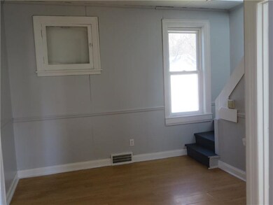 The Dining Room is Located Between the Kitchen & L