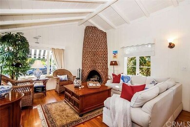 Cozy wood burning fireplace, is  focal point of th