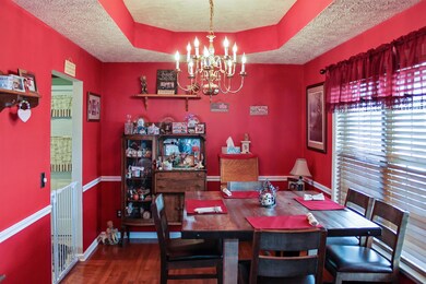To the right of the front door is this elegant formal dining room with lots of natural light