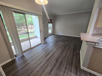 Unfurnished living room with ornamental molding, 