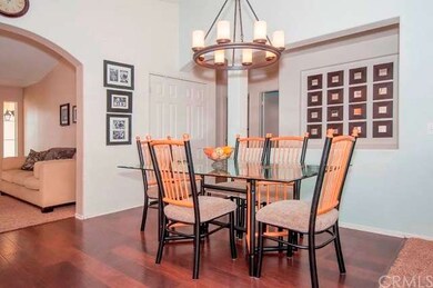 Love that Light Fixture!  Wood Laminate Flooring. 