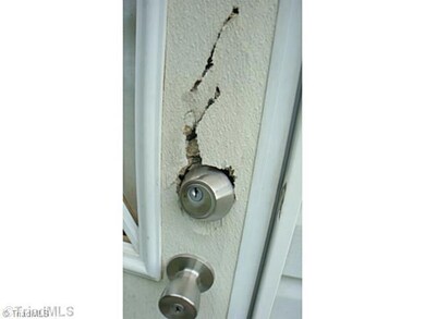 Exterior Back. back door damaged