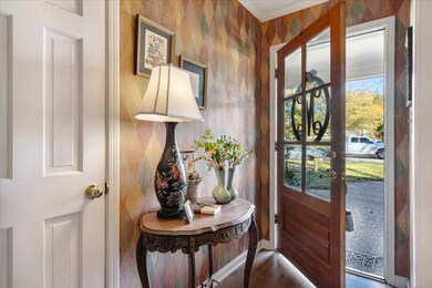 Doorway to outside with hardwood / wood-style floo