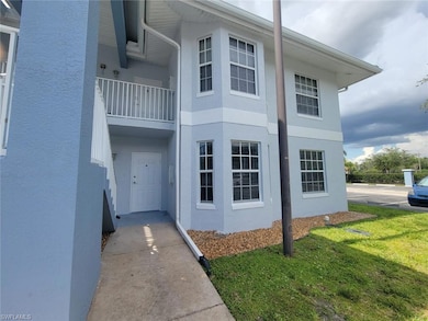 View of home's exterior with stucco siding and a yard