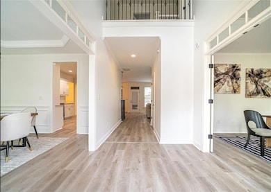 Foyer featuring light wood-style flooring, ornamen