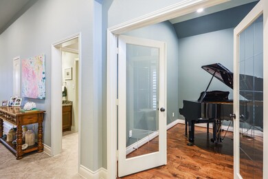 When you walk in from the entry the formal study is to the right with wood flooring.