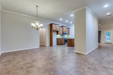 Opens to the kitchen and a wide hallway to living 