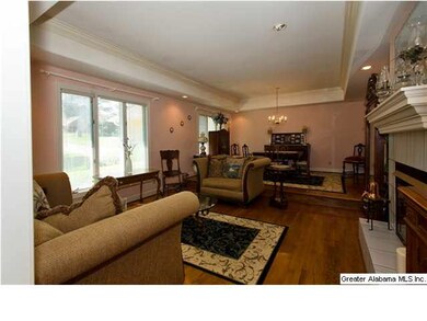 Step down formal living room with large mantle, ga