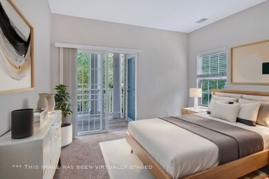 The primary bedroom features convenient access to the patio deck.