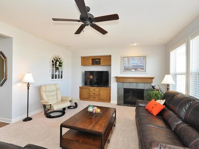 Family Room Boasts Fireplace, Tons Of Windows & Op