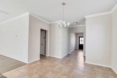 Hallway leading to garage and half bathroom