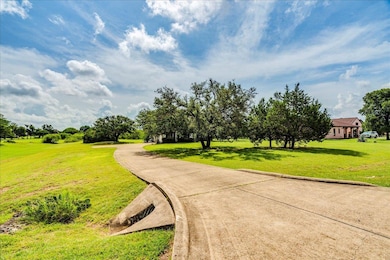 View of property's community featuring a lawn