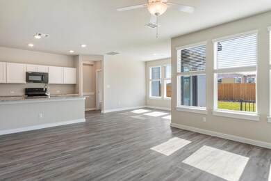 Kitchen featuring white cabinets, visible vents, 