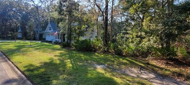 Shows the house next door. NOT included with lot.