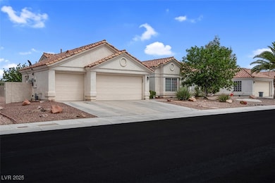 Mediterranean / spanish home with a garage, a tile