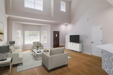 Living area with light wood finished floors, base