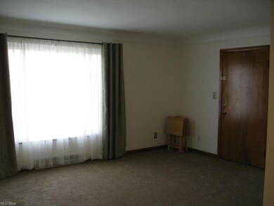 Spacious 18x12 Living Rm with new carpeting and draperies. (Beautiful hardwood flooring underneath.)