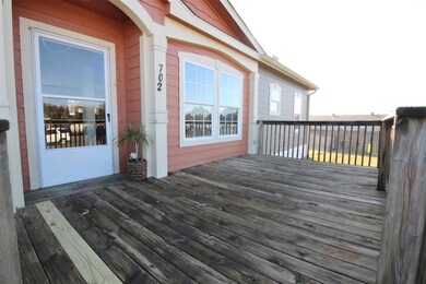 Large front porch/deck.