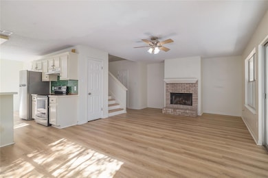 Unfurnished living room featuring light wood-styl