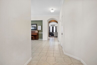Entry way of the home offers a coat closet to the right and left is home office and formal dining room.