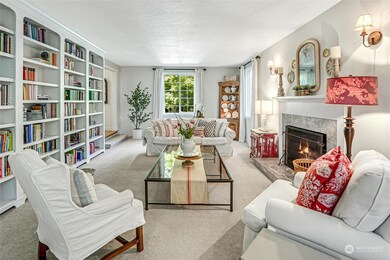 Living room with gorgeous built-in bookshelves and cozy fireplace.
