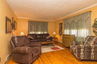 Spacious living room with original hardwood floors