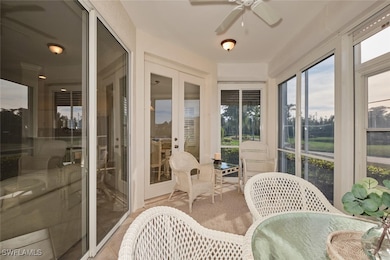 Sunroom with ceiling fan and french doors