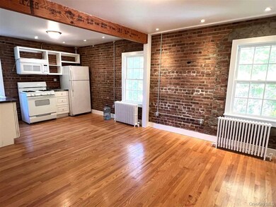 Kitchen and dining area. Beam in ceiling