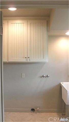 utility room with sink & cabinets