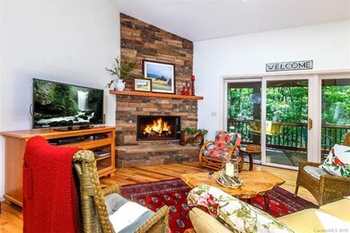 Great Room with Rock Gas Log Fireplace and slider 