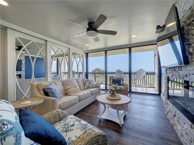 Floor-to-ceiling windows flood the space with natu