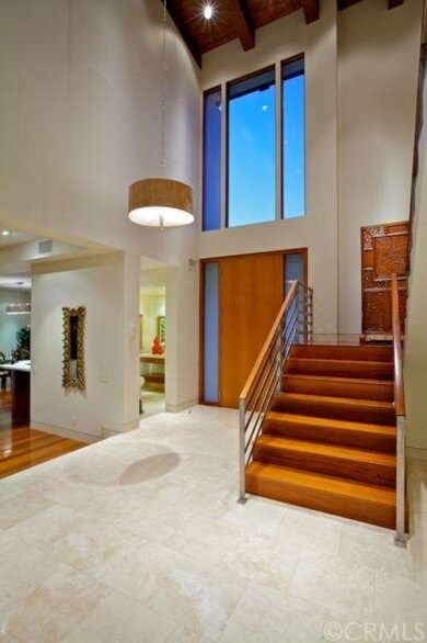 The natural teak stairway to the second floor. Tro