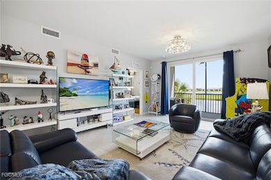 Tiled living room with a chandelier