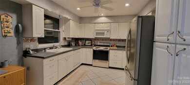 Kitchen w/recessed lightning & tile floors