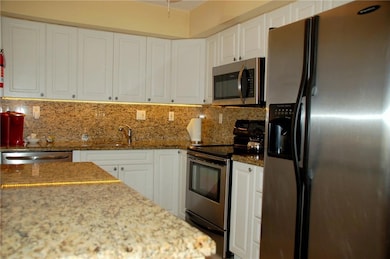Kitchen with granite counters and SS appliances