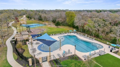 Community pool featuring a patio