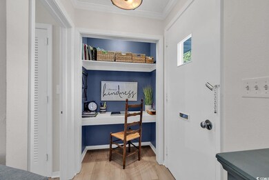 Office area with light hardwood / wood-style floor
