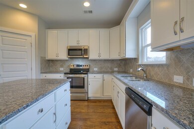 This kitchen has tons of cabinet space, counter sp