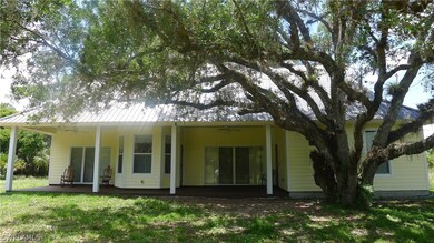 Back side of home with open porch