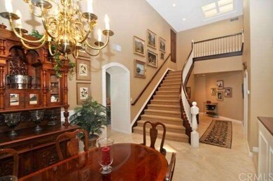 Dramatic Curved Staircase Leads to 2nd Floor Hallw